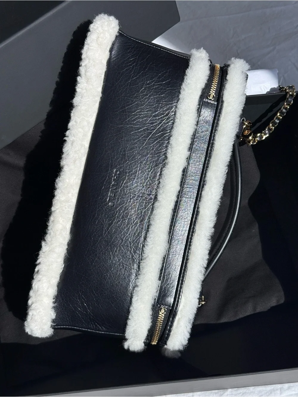 CHANEL Black Leather Shoulder Bag with White Shearling Trim